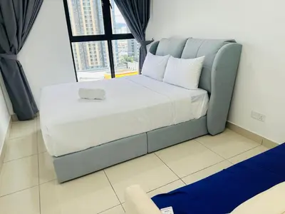 a large bed in a room with a large window at Trion sky suite KL in Kuala Lumpur