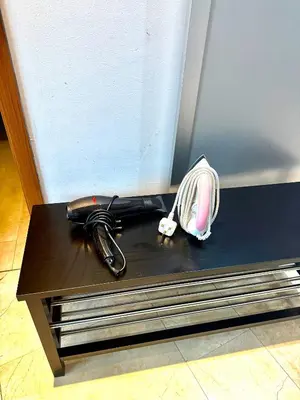 a black umbrella sitting on top of a black table at Vortex Suites Apartment Klcc in Kuala Lumpur