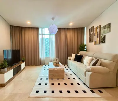 a living room with a couch and a tv at 30 OFF Monthly l Premium 3BR Suite in KLCC in Kuala Lumpur