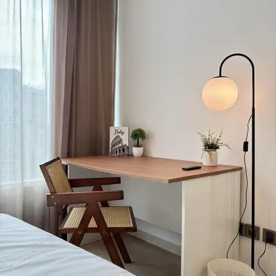 a desk in a bedroom with a lamp and a chair at 30 OFF Monthly l Premium 3BR Suite in KLCC in Kuala Lumpur