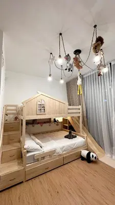 a bedroom with a large wooden bed in a room at KayooKiddieHouse KLCC Kids Friendly at Kg Baru KL in Kuala Lumpur