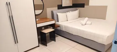 a small bedroom with a bed and a mirror at Majestic Residence Klcc By DIVINA in Kuala Lumpur