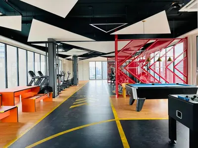 a gym with a pool table and ping pong tables at Majestic Suites klcc By Falak in Kuala Lumpur