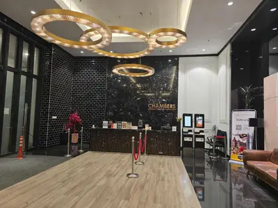 a bowling alley in a lobby with a chandelier at Chambers Residences Kuala Lumpur BY BJS in Kuala Lumpur