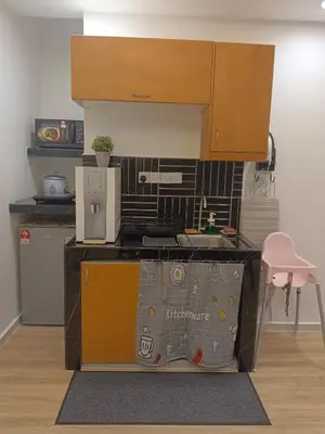 a small kitchen with a counter and a sink at Fahrenheit 88 4R in Kuala Lumpur