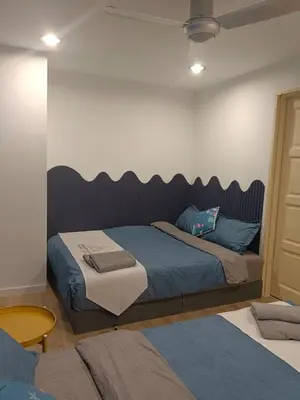 a bedroom with a bed with a large headboard at Fahrenheit 88 4R in Kuala Lumpur