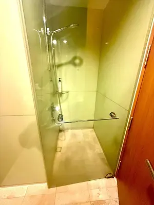 a shower with a glass door in a bathroom at Soho Suites Klcc By Bukit Bintang in Kuala Lumpur