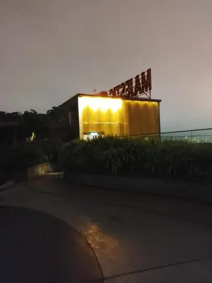a building with lights on it at night at Majestic Suites Quill Mall Apartment in Kuala Lumpur