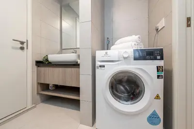 a laundry room with a washing machine in it at The Atrium by The Conts in Kuala Lumpur