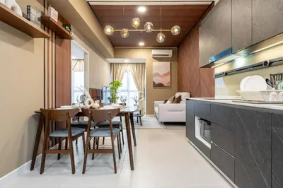 a kitchen and dining room with a table and chairs at The Atrium by The Conts in Kuala Lumpur