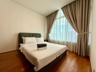 a bedroom with a bed and a large window at vortex suites apatment by sapporo in Kuala Lumpur