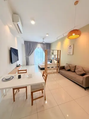 a living room with a couch and a table at Chambers Suites By Grands in Kuala Lumpur