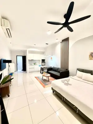 a bedroom with a bed and a ceiling fan at Chambers Suites By Grands in Kuala Lumpur
