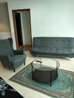 a living room with a couch and a coffee table at Vortex suites Klcc near KL in Kuala Lumpur
