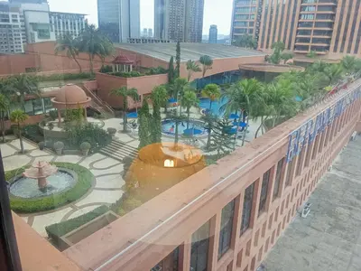an aerial view of a courtyard with a fountain on a building at Times square Suites at Time Square KL in Kuala Lumpur