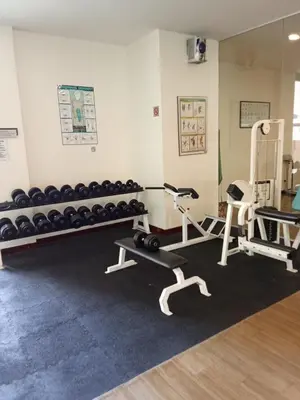 a gym with two treadmills and weights at Times square Suites at Time Square KL in Kuala Lumpur