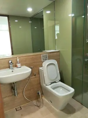 a bathroom with a toilet and a sink and a shower at Vortex suites Klcc near KL Area in Kuala Lumpur