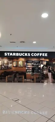 a store with a starbucks coffee sign in a mall at Sky Suites at Quill Residence Kuala Lumpur in Kuala Lumpur