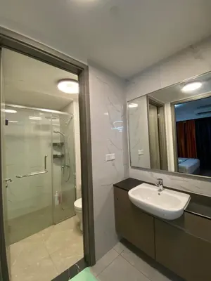 a bathroom with a sink and a shower and a mirror at Agile Heaven Luxury Suite bukit bintang in Kuala Lumpur