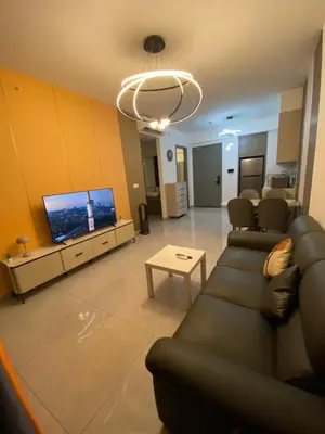 a living room with a couch and a flat screen tv at Agile Heaven Luxury Suite bukit bintang in Kuala Lumpur