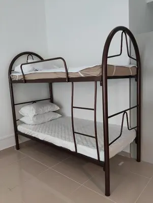 a bunk bed in a room with two bunk beds at Female Hostel Regalia Residence in Kuala Lumpur