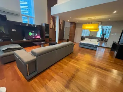 a living room with a couch and a table at Kuala Lumpur luxury Duplex suits in Kuala Lumpur