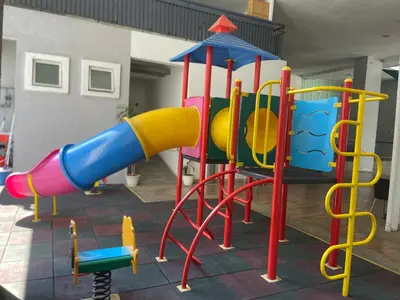 a playground with a bunch of different colored play equipment at Kuala Lumpur luxury Duplex suits in Kuala Lumpur
