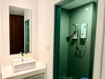 a bathroom with a sink and a shower with a mirror at Chod ling pong by mercu summer KLCC in Kuala Lumpur