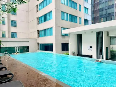 a large swimming pool in front of a building at Chod ling pong by mercu summer KLCC in Kuala Lumpur