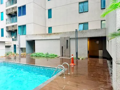 a swimming pool in front of a building at Chod ling pong by mercu summer KLCC in Kuala Lumpur
