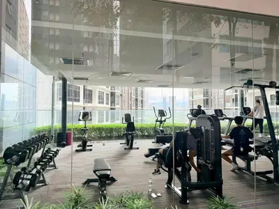 a gym with people exercising on machines in a building at Chod ling pong by mercu summer KLCC in Kuala Lumpur
