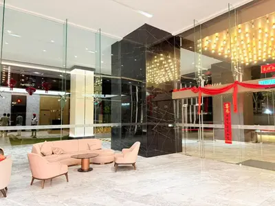 a lobby with a couch and chairs in a building at Next To KLCC By Home Stay in Kuala Lumpur