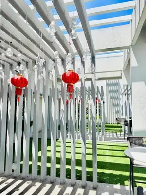 a lobby with red and white columns and grass at Agile Residence Kuala Lumpur Bukit Bintang in Kuala Lumpur