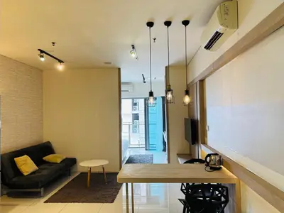 a living room with a couch and a table at STAR Hotel Apartment in Kuala Lumpur