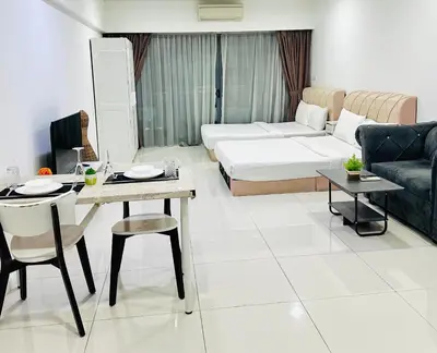 a living room with a couch and a table at Lux Retreat Home At Mercu Summer in Kuala Lumpur