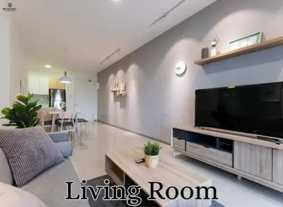 a living room with a large flat screen tv at Skyline Suites Kuala Lumpur in Kuala Lumpur
