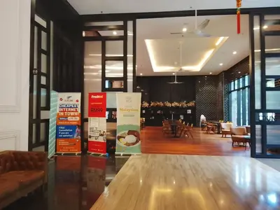 a lobby with a table and aasteryasteryasteryasteryasteryasteryasteryasteryastery at Chamber Klcc Suites Luxury Home in Kuala Lumpur