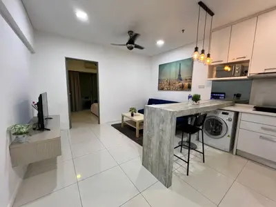 a kitchen and living room with a washer and dryer at Elegant Home at Mercu Summer Suites By KLCC in Kuala Lumpur