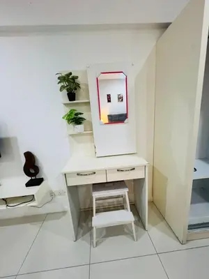 a white desk with a mirror and a stool at Elegant Home at Mercu Summer Suites By KLCC in Kuala Lumpur