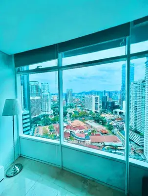 a room with a large window with a view of a city at Vortex Klcc By welcomes in Kuala Lumpur