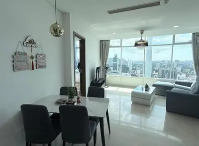 a living room with a table and a couch at Vortex Klcc By welcomes in Kuala Lumpur