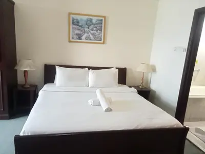 a bed in a hotel room with a towel on it at RKSON SUITE At KL in Kuala Lumpur
