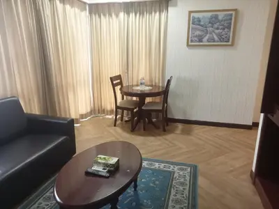 a living room with a couch and a table at RKSON SUITE At KL in Kuala Lumpur