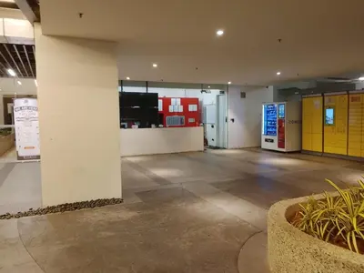 a lobby of a building with a gas station at Quill Residence King House in Kuala Lumpur
