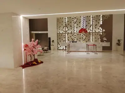 a lobby with a large wall of lights at Quill Residence King House in Kuala Lumpur