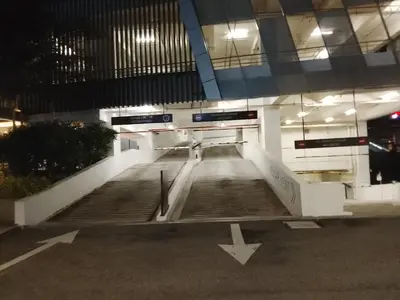 an empty parking lot in a building at night at Quill Residence King House in Kuala Lumpur