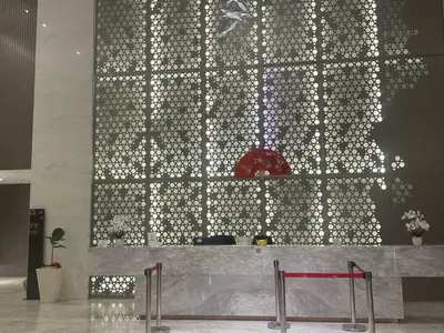 a wall of lights in a room with a table at Quill Residence King House in Kuala Lumpur