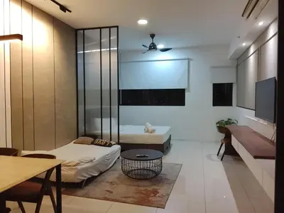 a living room with a couch and a table at Mix Home At Chamber Residence in Kuala Lumpur