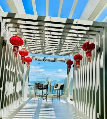 a balcony with red lanterns on top of a building at Agile Residence By Infinity Pool in Kuala Lumpur