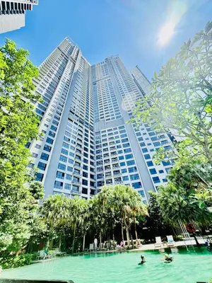 a large building with a pool in front of it at Agile Residence By Infinity Pool in Kuala Lumpur